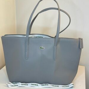 Lacoste Classic Gray Tote
New never used . Color light gray . Large size